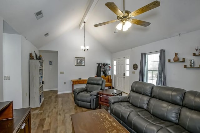70380 K St, Covington, LA 70433 - living area featuring wood finished floors, beam ceiling, ceiling fan, a chandelier, and high vaulted ceiling