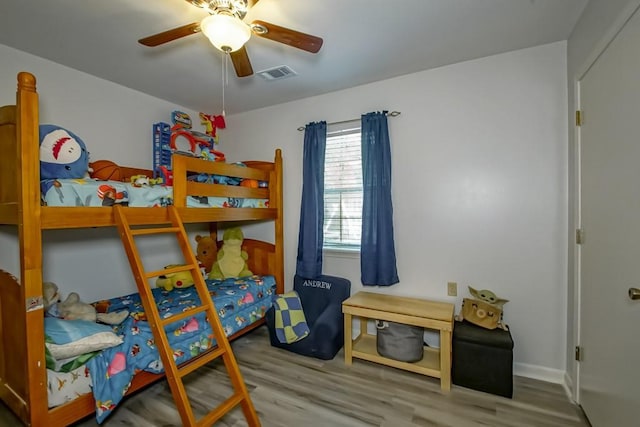 70380 K St, Covington, LA 70433 - bedroom with wood finished floors and a ceiling fan