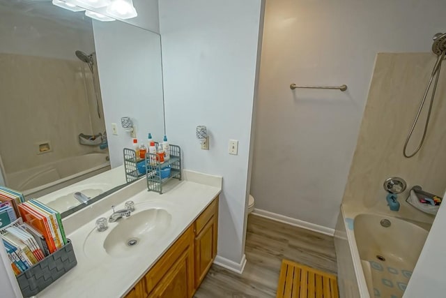 70380 K St, Covington, LA 70433 - bathroom with vanity, shower / tub combination, and wood finished floors