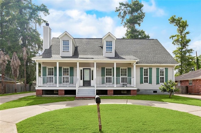 175 Dunleith Dr, Destrehan, LA 70047 - cape cod home with a porch, a chimney, curved driveway, and a shingled roof