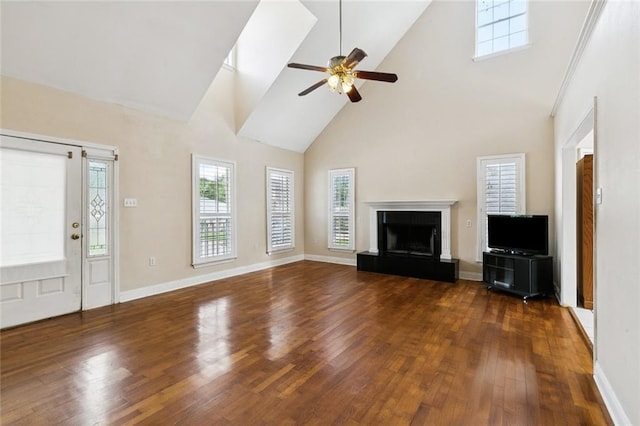 175 Dunleith Dr, Destrehan, LA 70047 - unfurnished living room featuring high vaulted ceiling, wood finished floors, ceiling fan, and a fireplace with raised hearth