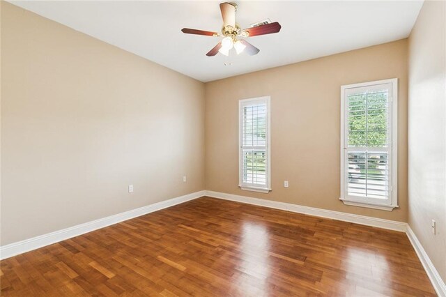 175 Dunleith Dr, Destrehan, LA 70047 - empty room with plenty of natural light, wood finished floors, and a ceiling fan