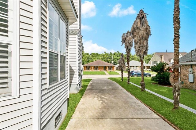 175 Dunleith Dr, Destrehan, LA 70047 - surrounding community with a yard, concrete driveway, and a residential view
