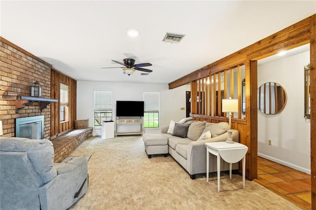 20226 Chandler Dr, Covington, LA 70435 - living area featuring ceiling fan, a fireplace, and light tile patterned floors