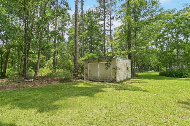 20226 Chandler Dr, Covington, LA 70435 - view of grassy yard featuring a storage shed