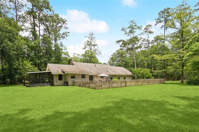 20226 Chandler Dr, Covington, LA 70435 - back of property featuring a sunroom and a chimney