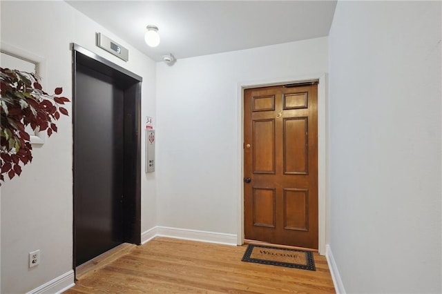 214 Chartres St Unit 3, New Orleans, LA 70130 - entryway featuring elevator and light wood-style flooring