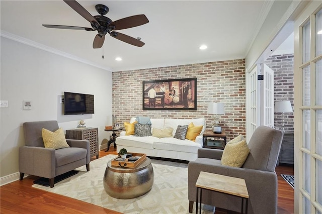 214 Chartres St Unit 3, New Orleans, LA 70130 - living room featuring wood finished floors, brick wall, crown molding, ceiling fan, and recessed lighting