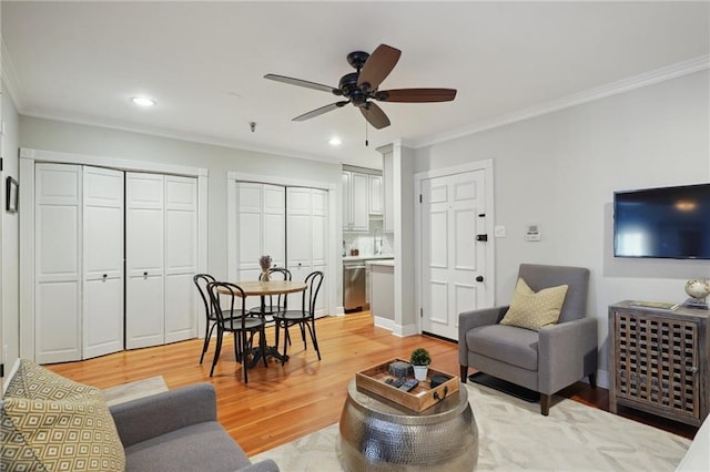 214 Chartres St Unit 3, New Orleans, LA 70130 - living room with crown molding, a ceiling fan, light wood-style flooring, and recessed lighting
