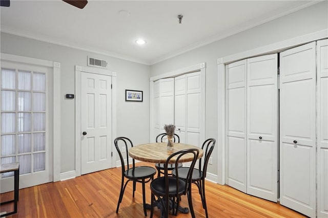 214 Chartres St Unit 3, New Orleans, LA 70130 - dining space featuring light wood finished floors, ornamental molding, recessed lighting, and a ceiling fan