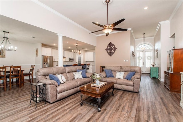 42013 Red Maple St, Hammond, LA 70403 - living room with a chandelier, wood finished floors, ornamental molding, ceiling fan, and decorative columns