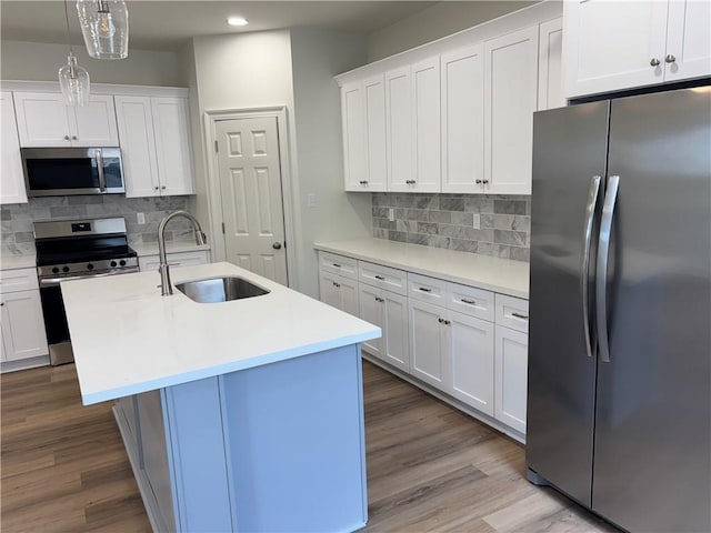 2035 Huey P Lng Ave, Gretna, LA 70053 - kitchen with stainless steel appliances, recessed lighting, decorative backsplash, light countertops, and wood finished floors