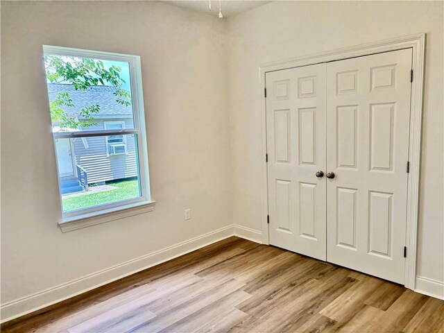 2035 Huey P Lng Ave, Gretna, LA 70053 - unfurnished bedroom featuring wood finished floors and a closet