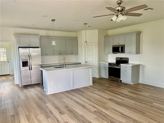 2444 Huey P Long Ave, Gretna, LA 70053 - kitchen with stainless steel appliances, light wood-style flooring, and light countertops