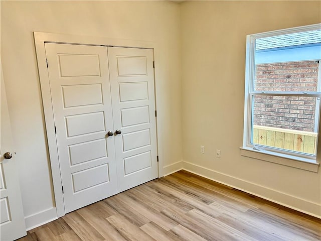 2444 Huey P Long Ave, Gretna, LA 70053 - unfurnished bedroom with light wood-type flooring and a closet