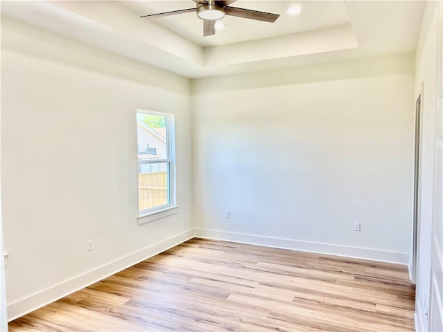 2444 Huey P Long Ave, Gretna, LA 70053 - spare room with a ceiling fan, light wood-type flooring, a raised ceiling, and recessed lighting