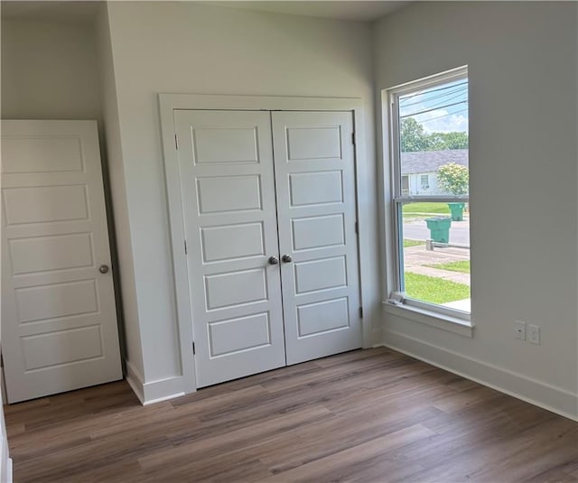 2019 Huey P Long Ave, Gretna, LA 70053 - unfurnished bedroom with wood finished floors and a closet