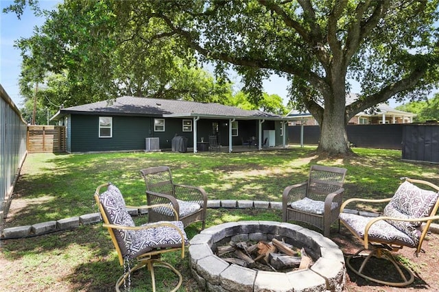 108 Cadow St, Paradis, LA 70080 - rear view of house with a fire pit and a fenced backyard