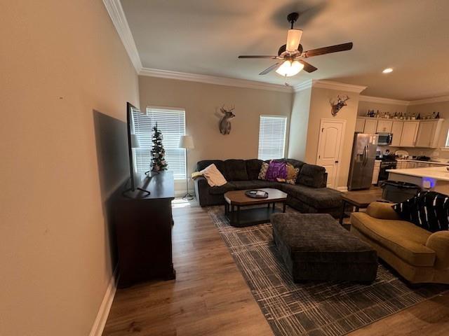 7248 Kenilworth Crossing Ave, Baton Rouge, LA 70820 - living room with ceiling fan, wood finished floors, and crown molding