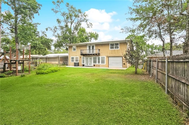 453 Olive Dr, Slidell, LA 70458 - back of house with french doors, a balcony, and a garage