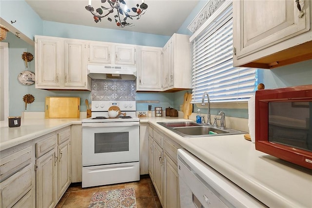 515 Sidney St, Metairie, LA 70005 - kitchen featuring white appliances, under cabinet range hood, light countertops, and a chandelier