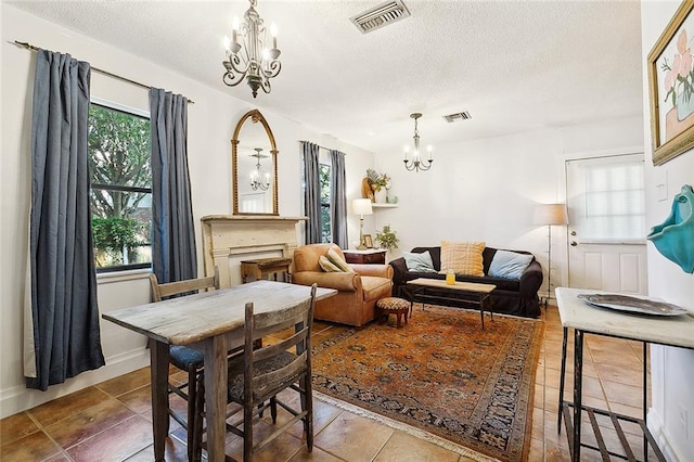 515 Sidney St, Metairie, LA 70005 - living area featuring a chandelier, a textured ceiling, and tile patterned flooring