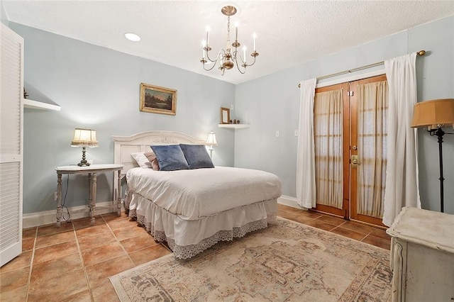 515 Sidney St, Metairie, LA 70005 - bedroom with a chandelier, tile patterned floors, and a textured ceiling