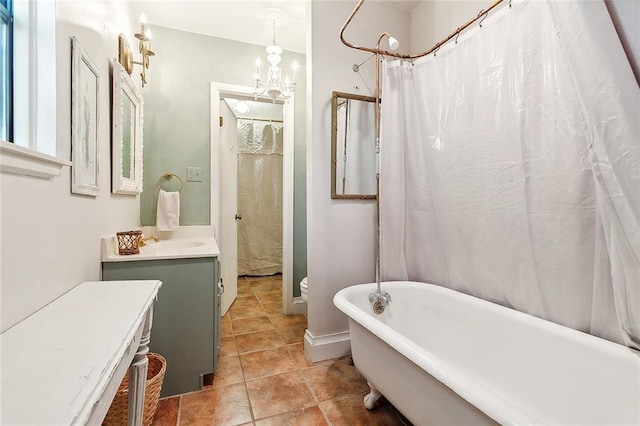 515 Sidney St, Metairie, LA 70005 - full bathroom featuring vanity, a freestanding tub, and tile patterned flooring