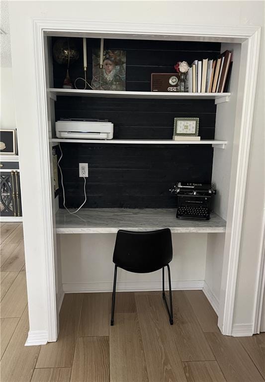 104 Inverrary Ct, Slidell, LA 70460 - office area featuring built in desk and wood finished floors