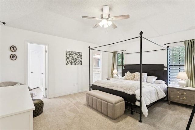 104 Inverrary Ct, Slidell, LA 70460 - bedroom featuring light carpet, ensuite bath, lofted ceiling, and ceiling fan