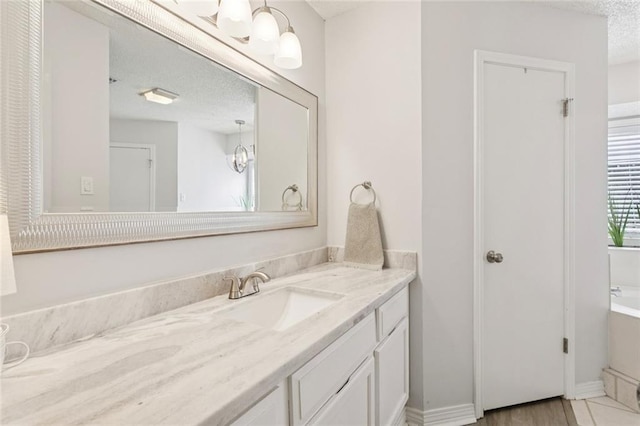 104 Inverrary Ct, Slidell, LA 70460 - bathroom with vanity and a textured ceiling