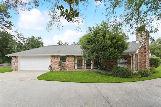 104 Inverrary Ct, Slidell, LA 70460 - ranch-style home featuring concrete driveway, an attached garage, brick siding, a chimney, and a shingled roof