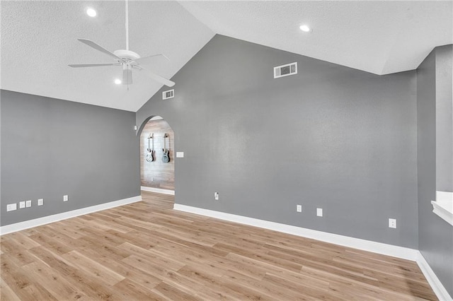 506 Ellington Ave, Luling, LA 70070 - empty room featuring arched walkways, ceiling fan, light wood-type flooring, high vaulted ceiling, and recessed lighting