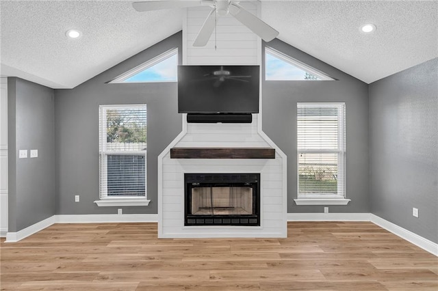 506 Ellington Ave, Luling, LA 70070 - unfurnished living room with a textured ceiling, vaulted ceiling, ceiling fan, light wood-type flooring, and plenty of natural light