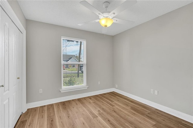 506 Ellington Ave, Luling, LA 70070 - unfurnished bedroom with a closet, light wood-style floors, ceiling fan, and a textured ceiling