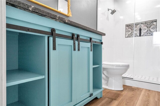 506 Ellington Ave, Luling, LA 70070 - bathroom featuring tiled shower and wood finished floors