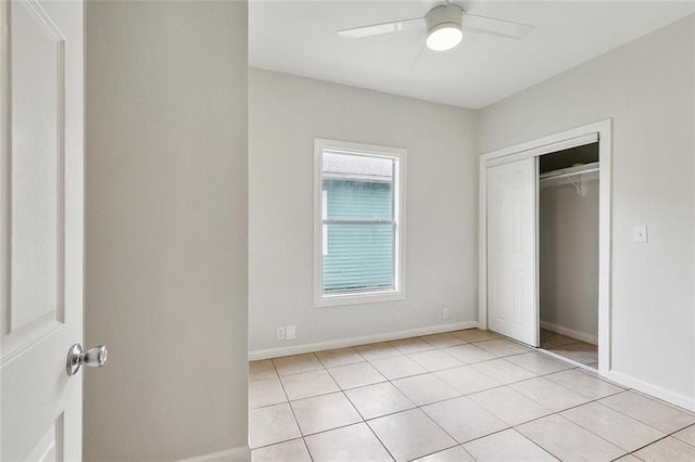 8711 Olive St, New Orleans, LA 70118 - unfurnished bedroom featuring light tile patterned flooring, a closet, and a ceiling fan