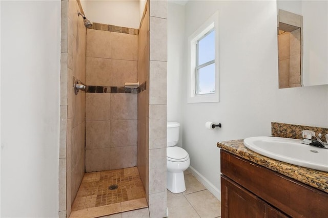 8711 Olive St, New Orleans, LA 70118 - bathroom with vanity, a tile shower, and tile patterned flooring