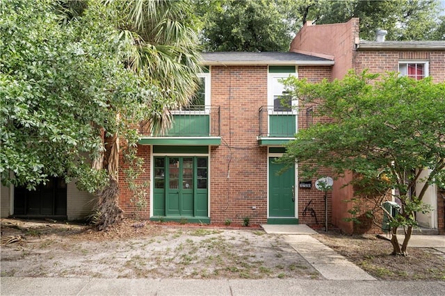 5720 Count Ln, New Orleans, LA 70126 - view of front of house with a balcony and brick siding