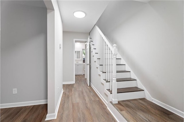 5720 Count Ln, New Orleans, LA 70126 - staircase with wood finished floors and baseboards