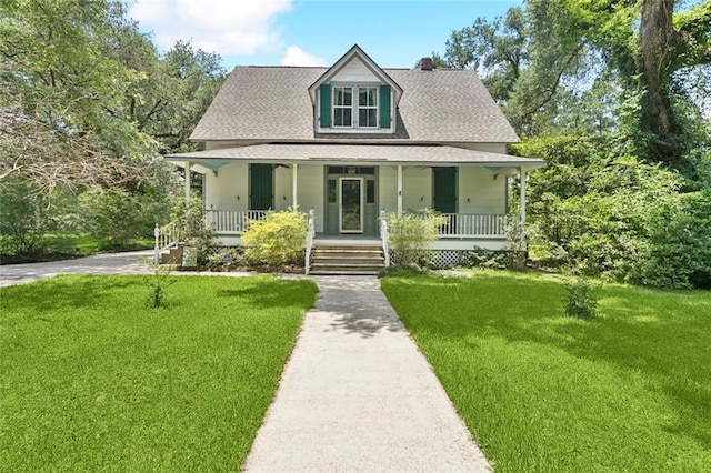 39267 Z Oaks Ln, Ponchatoula, LA 70454 - view of front of home with a front lawn, a porch, a chimney, and a shingled roof
