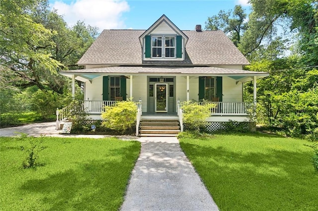 39267 Z Oaks Ln, Ponchatoula, LA 70454 - view of front of house featuring a porch, roof with shingles, and a front lawn
