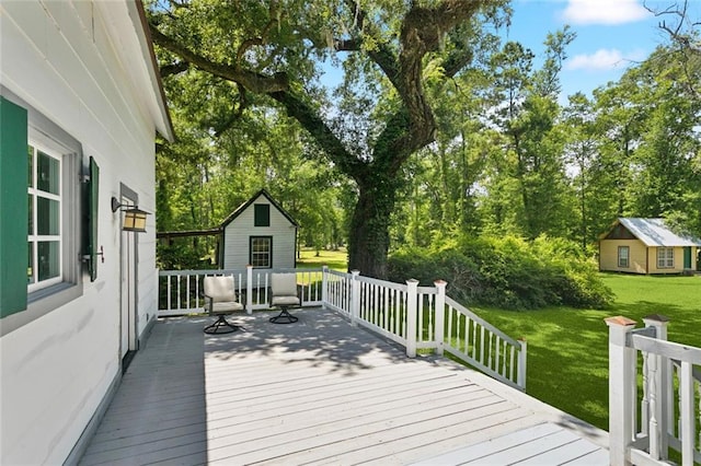 39267 Z Oaks Ln, Ponchatoula, LA 70454 - wooden deck with a yard, an outbuilding, and view of scattered trees