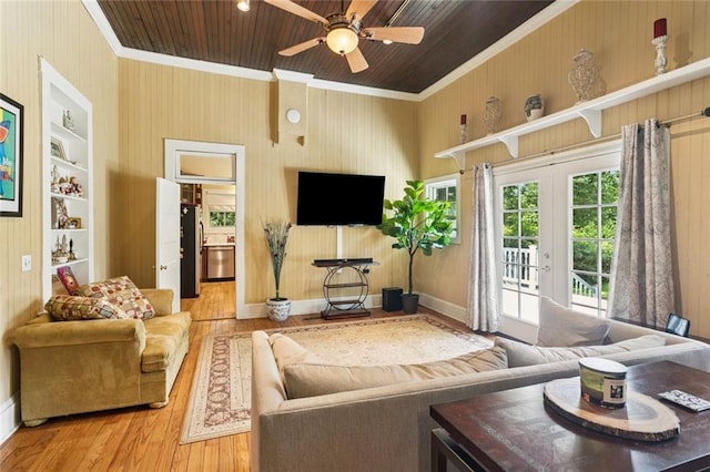 39267 Z Oaks Ln, Ponchatoula, LA 70454 - living area with wood finished floors, wooden ceiling, crown molding, french doors, and ceiling fan