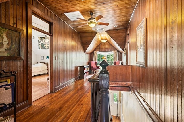 39267 Z Oaks Ln, Ponchatoula, LA 70454 - hall featuring wood walls, dark wood finished floors, an upstairs landing, and wooden ceiling