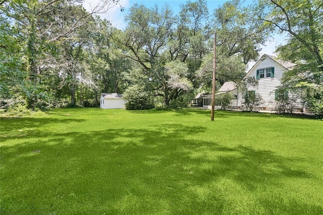 39267 Z Oaks Ln, Ponchatoula, LA 70454 - view of green lawn with an outbuilding