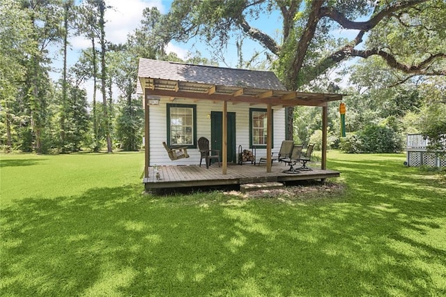 39267 Z Oaks Ln, Ponchatoula, LA 70454 - rear view of house featuring a lawn, a deck, and roof with shingles