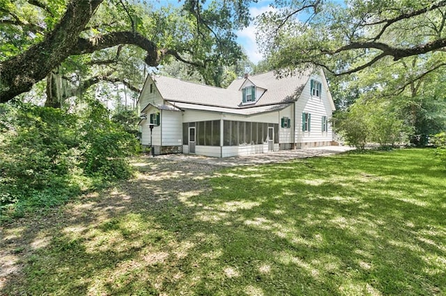 39267 Z Oaks Ln, Ponchatoula, LA 70454 - rear view of property featuring a sunroom and a lawn