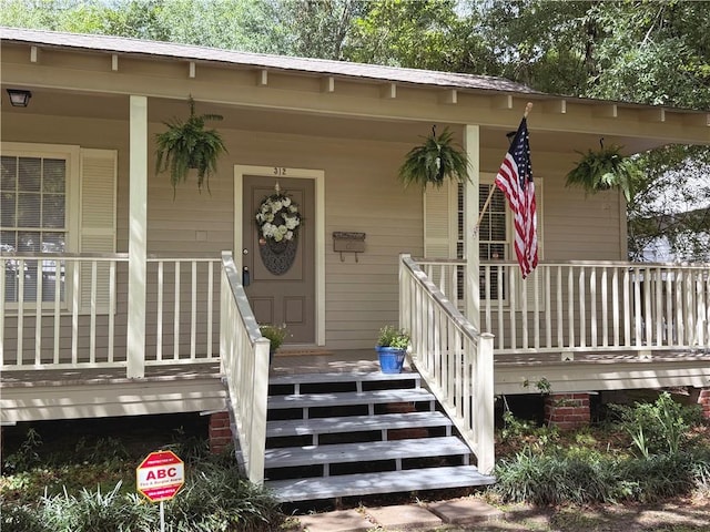 312 W 20th Ave, Covington, LA 70433 - doorway to property with a porch