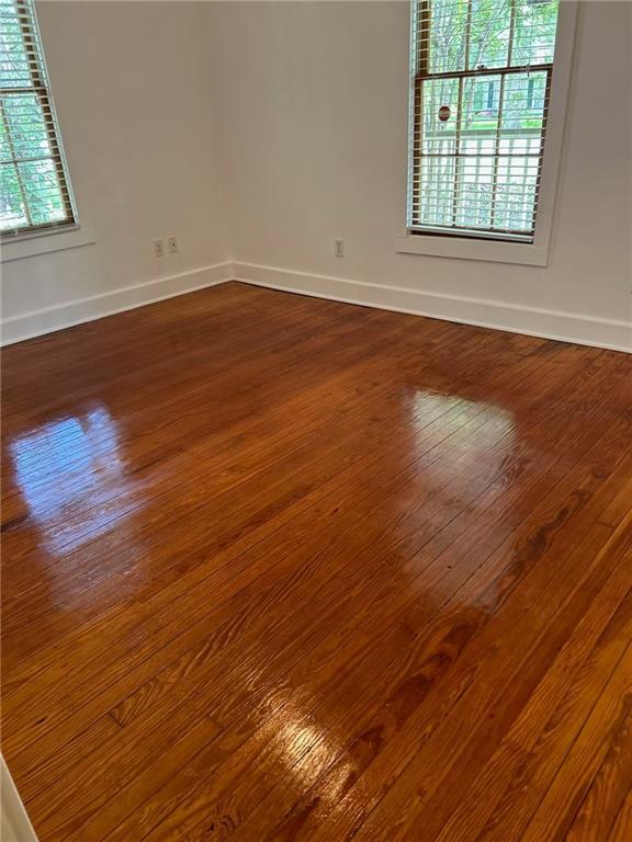 312 W 20th Ave, Covington, LA 70433 - unfurnished room with dark wood finished floors